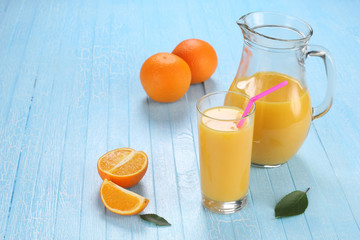 Glass and jug of orange juice