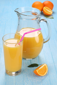 Glass and jug of orange juice
