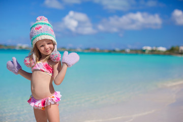 Little adorable girl on tropical beach