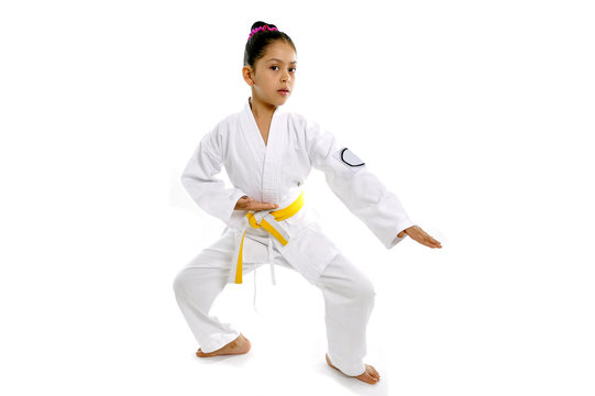 sweet little girl training body defense position like karate kid