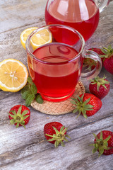 fresh and healthy homemade strawberry tea with lemon