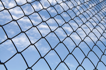 Fototapeta premium metallic net with blue sky background