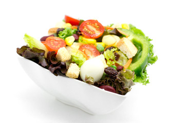 Fresh vegetable salad isolated on white