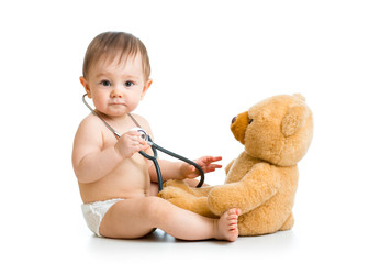 cute baby boy weared diaper with stethoscope and toy © Oksana Kuzmina