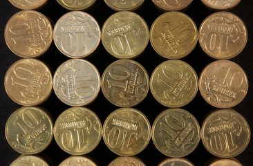 Coins stacked on a black background