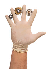 Hand in latex glove with used gears
