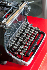 Old retro black metallic typewriter with antique round  keys.