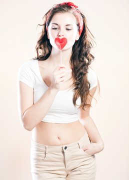 Pin up girl, valentine lollipop in shape of heart
