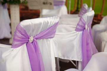 Decorated chairs at the wedding