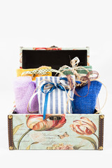 Gift box with decorative textile pouches