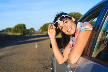 Happy woman on summer car travel