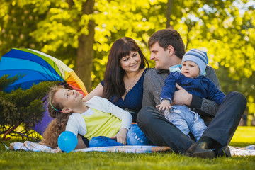 Happy family are plaing in the park