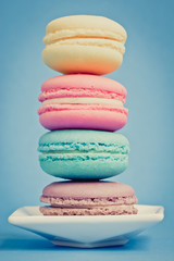 Sweet and colourful french macaroons on background