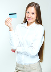 portrait of a smiling business woman holding blank credit card.