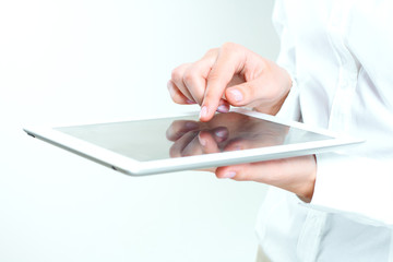 female hands holding tablet pc.