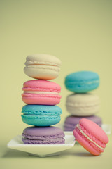 Sweet and colourful french macaroons on background