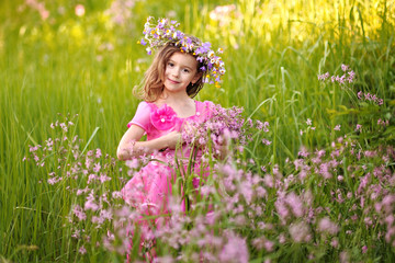 portrait of little girl outdoors in summer