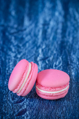 French macaroons on a wooden rustic table