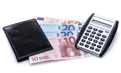 Composition with banknotes, a wallet and a calculator