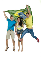 Group of attractive Brazil supporters jumping with Brazil Flag
