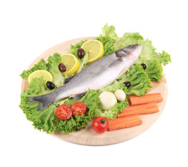 Fresh seabass on platter with lettuce.