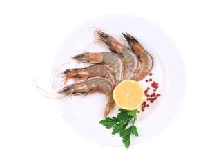 Raw shrimps on plate.