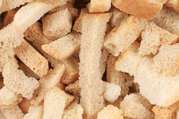 Long white bread croutons. Macro.