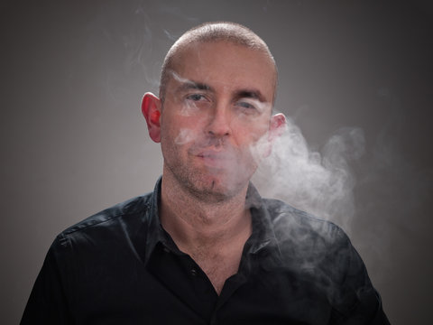 Man Smoking With Smoke In His Face