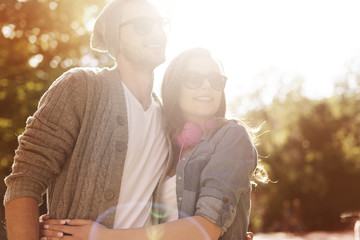 Portrait of hipster couple in sunny day