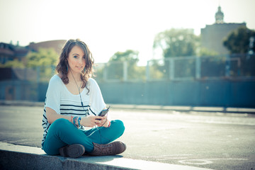 young beautiful brunette woman with smart phone