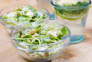 lemonade with parsley and bowl of vegetarian salad