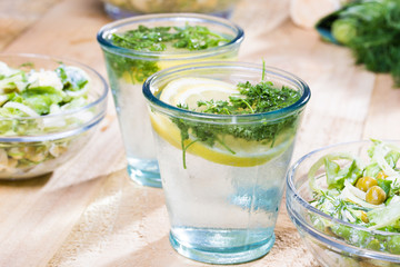 lemonade with parsley and bowl of vegetarian salad