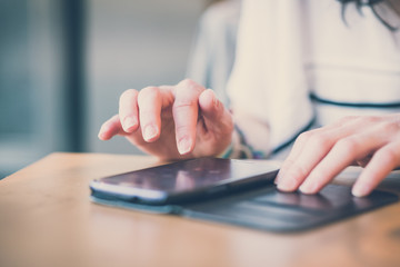 close up of woman hands using smart phone