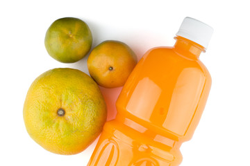 Oranges and bottle of orange juice