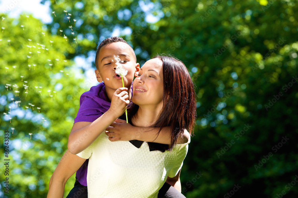 Wall mural portrait of a happy young mother with son