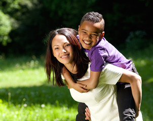 Mother and son smiling together outdoors