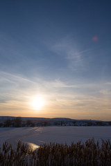 Fototapeta premium sunset on the lake in winter