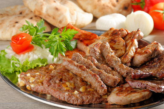 Wholesome platter of mixed meats including grilled steak