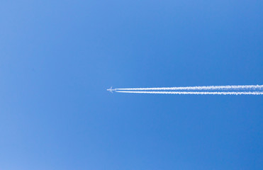 trace of an airplane in the blue sky