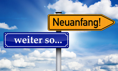 Fototapeta premium Wegweiser mit weiter so und Neuanfang!