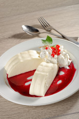 Italian dessert Panna cotta with red currant sorbet