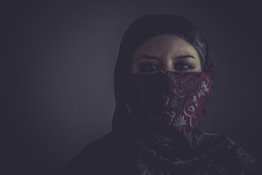 Arab mysterious woman with purple lace veil