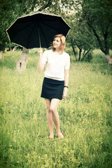 smiling girl with umbrella outdoors