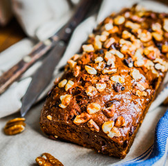 Homemade nut cake on wooden background