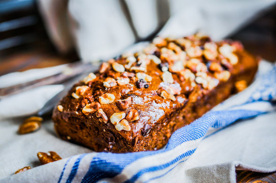 Homemade nut cake on wooden background