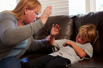 Mother Being Physically Abusive Towards Son At Home