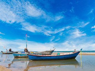 Fototapeta na wymiar Fishing boat at clean beach