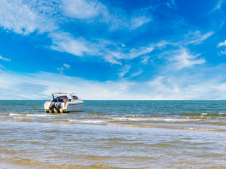 Fototapeta na wymiar Speedboat at clean beach