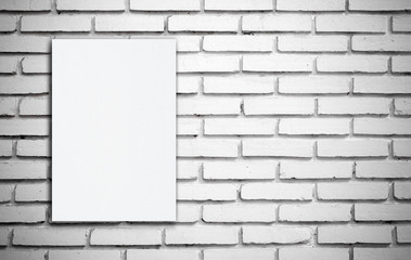White board on white brick wall.