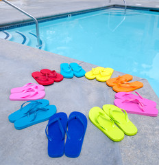 Color flip flops by the pool